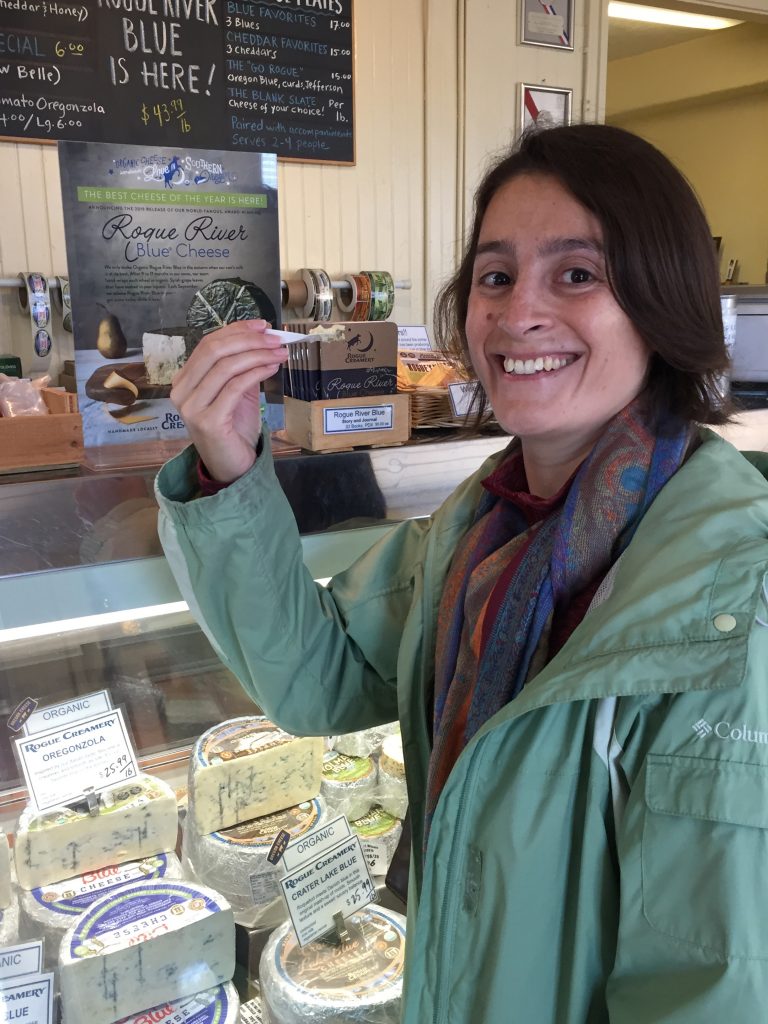 Maria happily tastes a sample of the 2019 Rogue River Blue cheese