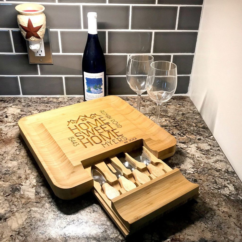 square wine and cheese board with knives