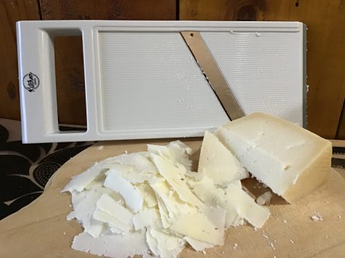 goat cheese sliced up all fancy with mandolin slicer