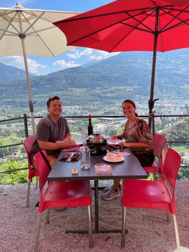 Maria and Neil enjoying vineyard views while eating lunch