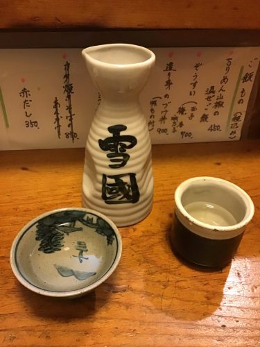 ceramic sake bottle with sake cups