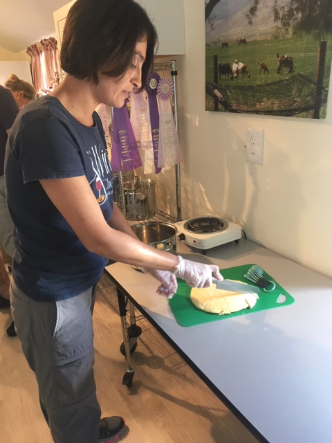 Maria milling the goat's milk mat